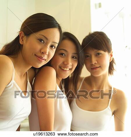 Stock Image - Close-Up, Asian Ethnicity, Cheerful, Casual Clothing, Brown Hair, Adults Only. Fotosearch