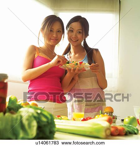 Stock Image - Young Adult, Youth Culture, Waist-Up, Togetherness, Adults Only, Tank Top. Fotosearch