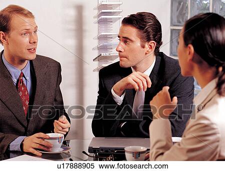 Stock Photography - discussing, training, formal, meeting, working, well dressed, speaking. Fotosearch