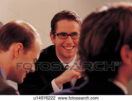 Stock Image - speaking, executives, workplace, spectacles. Fotosearch