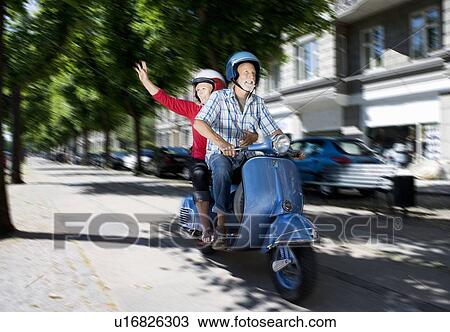 Couple on scooter View Large Photo Image Stock Image - Couple on scooter. Fotosearch