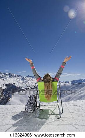 Girl sitting with arms in the air View Large Photo Image Stock Photograph - Girl sitting with arms in the air. Fotosearch