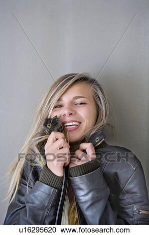 Stock Image - Girl smiles at camera. Fotosearch