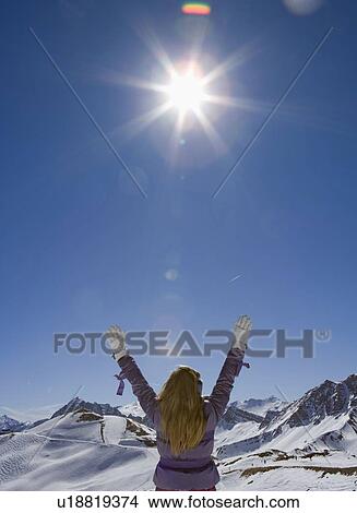 Picture - Girl with arms in the air. Fotosearch