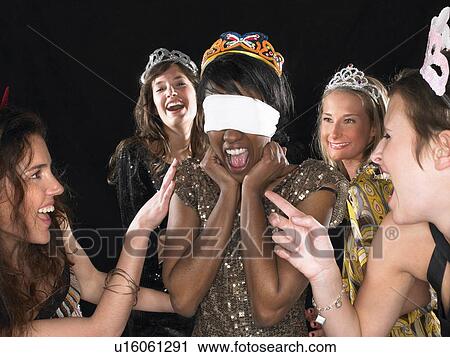 Stock Image - Group of women having a party. Fotosearch