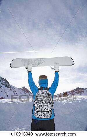 Man holding ski board View Large Photo Image Stock Image - Man holding ski board. Fotosearch