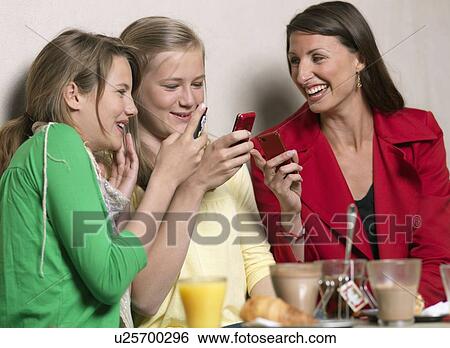 Mother and two girls laughing View Large Photo Image Stock Photograph - Mother and two girls laughing. Fotosearch