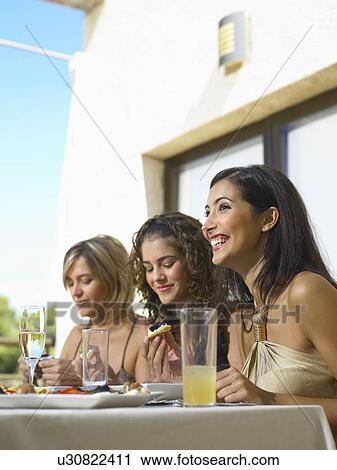 Mother with daughters celebrating View Large Photo Image Stock Image - Mother with daughters celebrating. Fotosearch