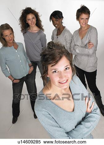 Stock Photography - Portrait of a woman, group behind. Fotosearch