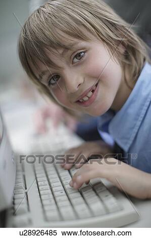 School boy using keyboard View Large Photo Image Stock Photography - School boy using keyboard. Fotosearch