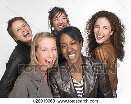 Women smiling and looking at the camera View Large Photo Image Stock Photo - Women smiling and looking at the camera. Fotosearch