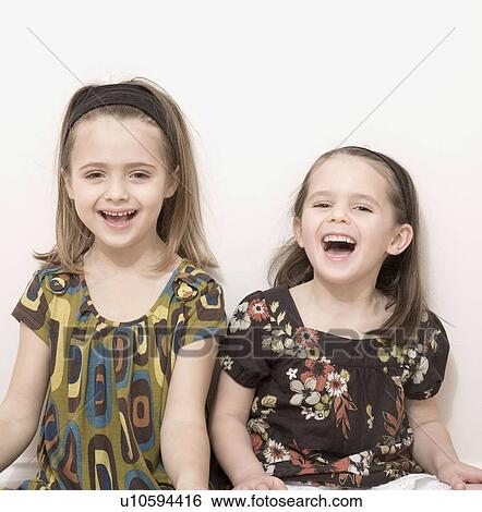 Stock Photograph - Young girls laughing. Fotosearch