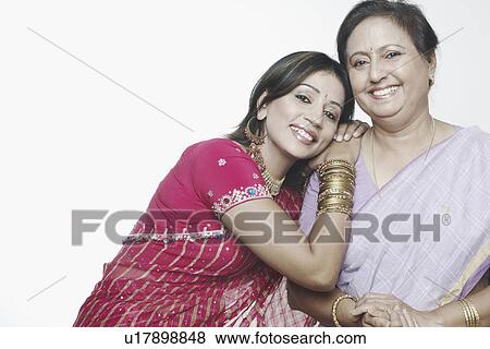 Portrait of a mature woman and a mid adult woman smiling View Large Photo Image Stock Photo - Portrait of a mature woman and a mid adult woman smiling. Fotosearch