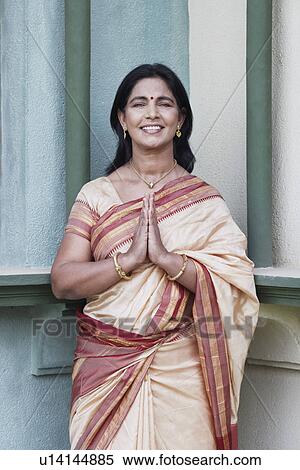 Portrait of a mature woman in a prayer position View Large Photo Image Stock Photography - Portrait of a mature woman in a prayer position. Fotosearch