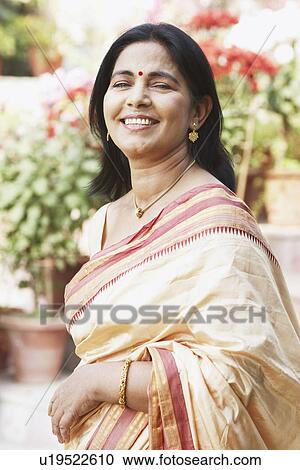Stock Image - Portrait of a mature woman smiling. Fotosearch
