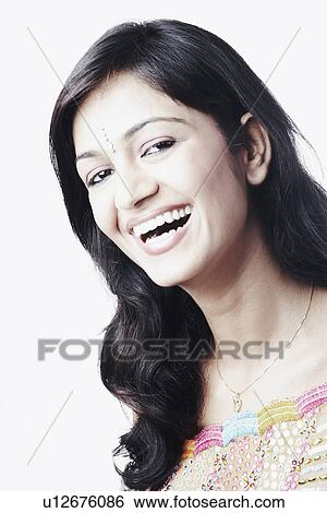Portrait of a young woman smiling View Large Photo Image Stock Photograph - Portrait of a young woman smiling. Fotosearch
