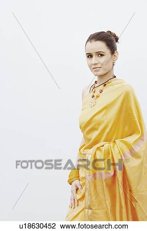 Portrait of a young woman standing View Large Photo Image Stock Image - Portrait of a young woman standing. Fotosearch