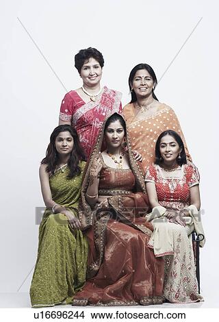 Portrait of two mothers with their daughters View Large Photo Image Picture - Portrait of two mothers with their daughters. Fotosearch
