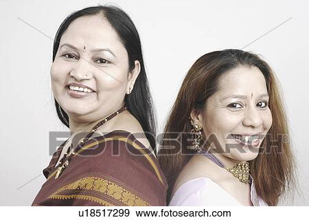 Side profile of a mature woman and a mid adult woman back to back View Large Photo Image Stock Photo - Side profile of a mature woman and a mid adult woman back to back. Fotosearch