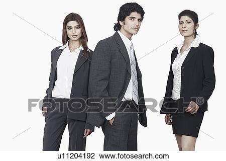 Portrait of a businessman and two businesswomen standing View Large Photo Image Stock Image - Portrait of a businessman and two businesswomen standing. Fotosearch