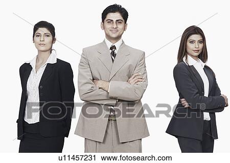 Stock Image - Portrait of a businessman and two businesswomen smiling. Fotosearch