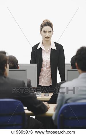 Portrait of a businesswoman giving a presentation View Large Photo Image Stock Image - Portrait of a businesswoman giving a presentation. Fotosearch