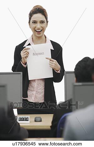 Stock Photography - Portrait of a businesswoman giving a presentation. Fotosearch
