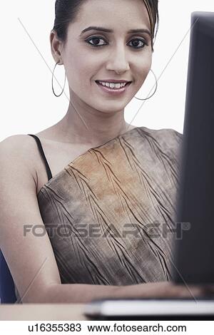 Stock Image - Portrait of a businesswoman smiling. Fotosearch