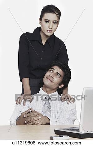 Portrait of a businesswoman with a businessman View Large Photo Image Stock Photograph - Portrait of a businesswoman with a businessman. Fotosearch