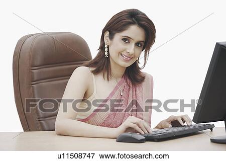 Portrait of a businesswoman working on a computer View Large Photo Image Stock Photo - Portrait of a businesswoman working on a computer. Fotosearch