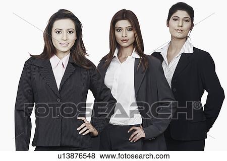 Portrait of three businesswomen standing in a row View Large Photo Image Stock Photo - Portrait of three businesswomen standing in a row. Fotosearch