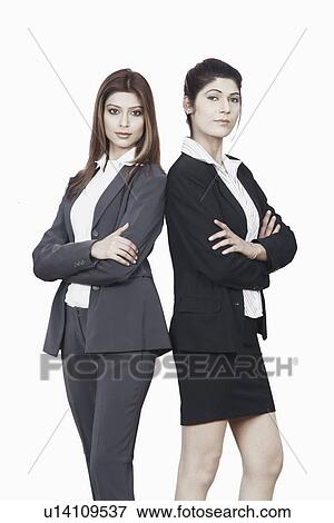 Portrait of two businesswomen standing with their arms crossed View Large Photo Image Stock Photo - Portrait of two businesswomen standing with their arms crossed. Fotosearch