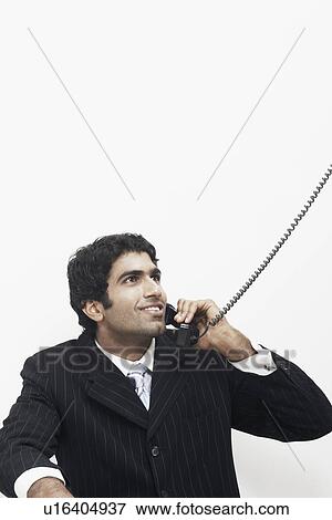 Stock Photo - Businessman talking on the telephone. Fotosearch