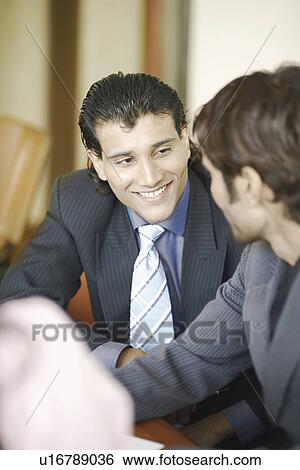 High angle view of two businessmen meeting View Large Photo Image Stock Photograph - High angle view of two businessmen meeting. Fotosearch