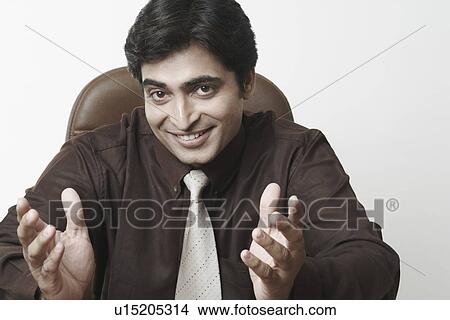 Picture - Portrait of a businessman smiling. Fotosearch