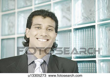 Portrait of a businessman smiling View Large Photo Image Stock Image - Portrait of a businessman smiling. Fotosearch