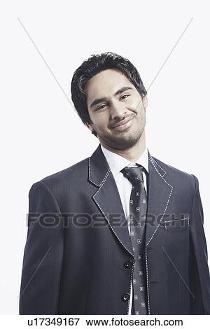 Portrait of a businessman smiling View Large Photo Image Stock Photo - Portrait of a businessman smiling. Fotosearch