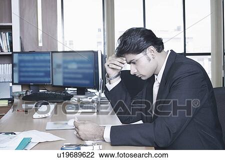 Side profile of a businessman sitting in an office View Large Photo Image Stock Image - Side profile of a businessman sitting in an office. Fotosearch