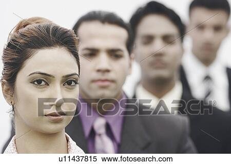 Stock Photography - Business executives standing in a row. Fotosearch