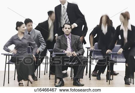 Stock Photo - Businessmen and businesswomen in an office. Fotosearch