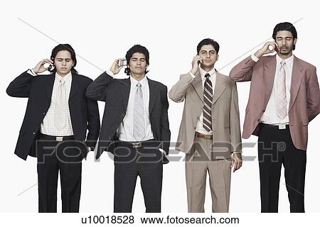 Stock Photo - Four businessmen talking on mobile phones. Fotosearch