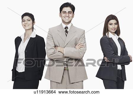Portrait of a businessman and two businesswomen smiling View Large Photo Image Picture - Portrait of a businessman and two businesswomen smiling. Fotosearch