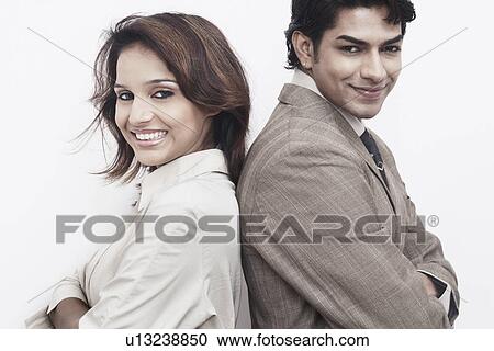 Side profile of a businessman and a businesswoman back to back View Large Photo Image Stock Image - Side profile of a businessman and a businesswoman back to back. Fotosearch