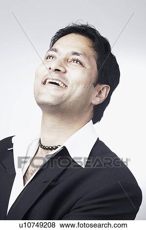 Stock Photo - Close-up of a businessman smiling. Fotosearch