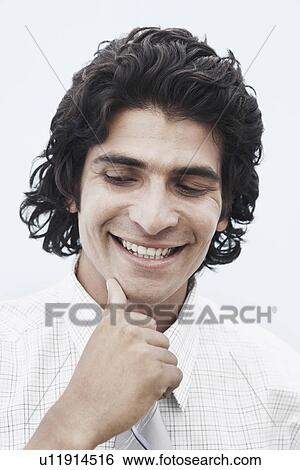 Stock Photograph - Close-up of a businessman smiling. Fotosearch