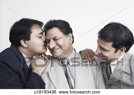 Stock Photograph - Close-up of a father with his two sons. Fotosearch