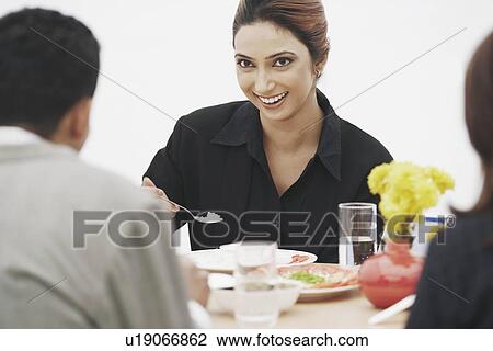 Stock Image - Close-up of a young woman smiling. Fotosearch
