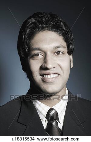 Picture - Portrait of a businessman smiling. Fotosearch