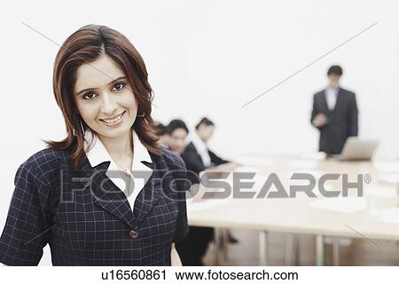 Stock Image - Portrait of a businesswoman smiling. Fotosearch