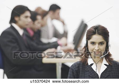 Picture - Portrait of a businesswoman wearing a headset. Fotosearch
